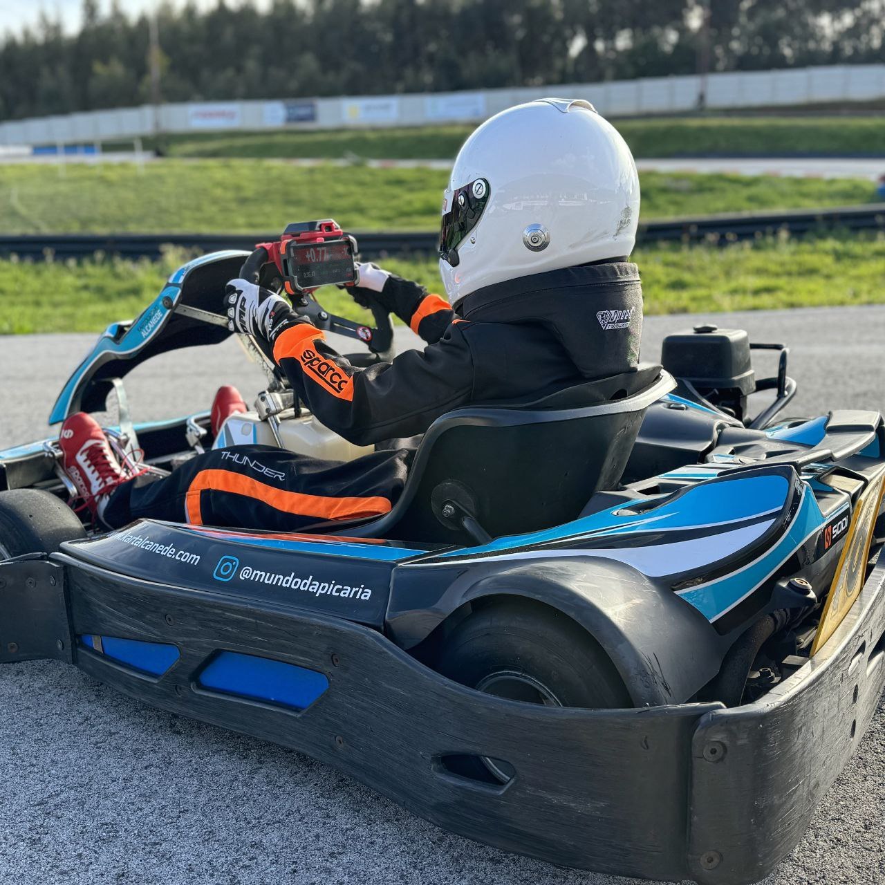 RaceCling mount installed on rental kart showing phone position for optimal viewing